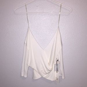white crisscrossed cropped tee